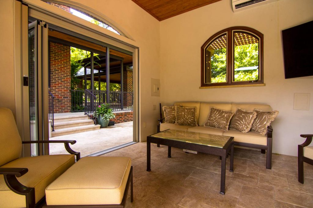 Custom interior design, seating area in pool house Kessler, TX By Nicole Arnold Interiors