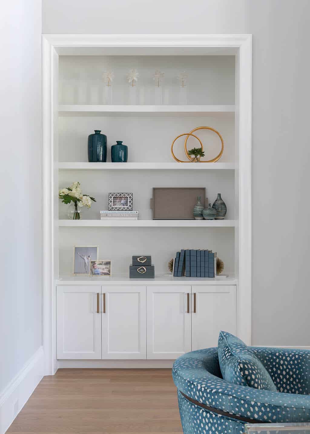 Chapel Creek Living Rm 2 Tips on how to style bookcases at a home in Chapel Creek at Frisco, TX