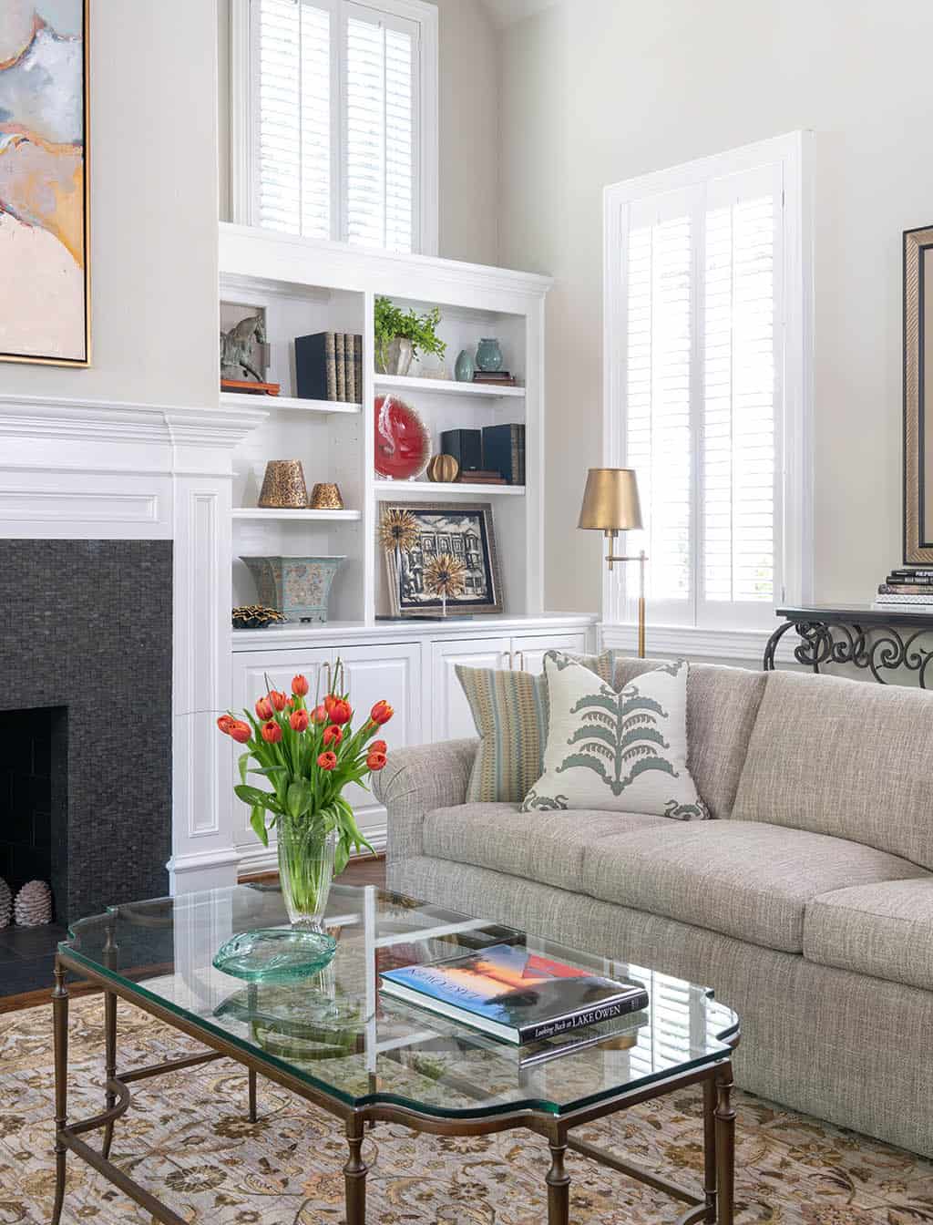 Living Room Coffee table decorated with books and other accessories in Plano, TX
